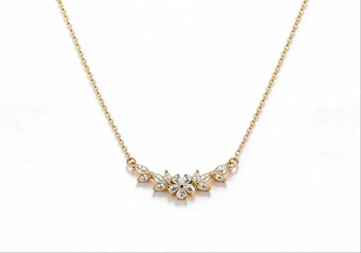 Gold-plated brass statement necklace featuring a cluster of flowers encrusted with zirconia stones