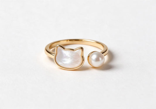 Cute cat-shaped ring featuring gold-plated brass and pearl