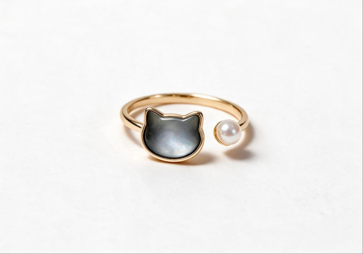 Cute cat-shaped ring featuring gold-plated brass and pearl in second color option