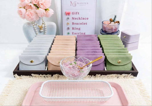 MAROVA JEWELS Lucky Scoop jewelry display set, featuring macaron velvet jewelry pouches in pastel shades, pink peony decor and a crystal glass bowl, romantic premium jewelry packaging presentation