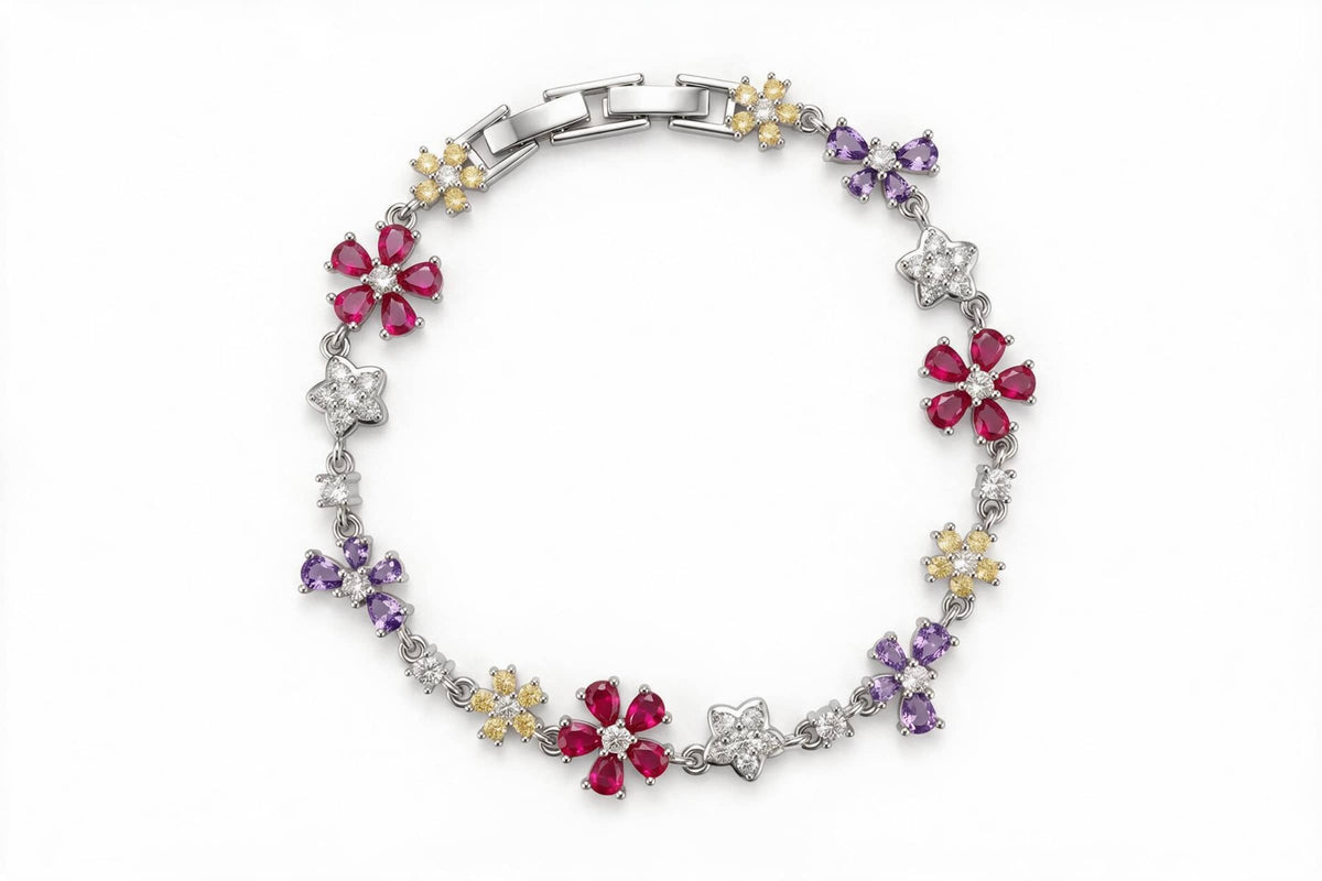 MAROVA JEWELS platinum-plated floral charm bracelet featuring mixed flower motifs including pear-cut red CZ blossoms, purple four-petal flowers, yellow CZ florets and pavé cubic zirconia star flowers, connected by fine chain with a sleek clasp, elegant fashion jewelry presented on white backdrop