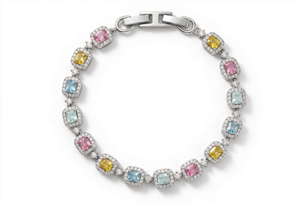 MAROVA JEWELS platinum-plated tennis bracelet featuring emerald-cut cubic zirconia stones in pink, yellow and light blue tones, each surrounded by a pavé cubic zirconia halo, with a refined H-shaped clasp, elegant fashion jewelry on clean white background