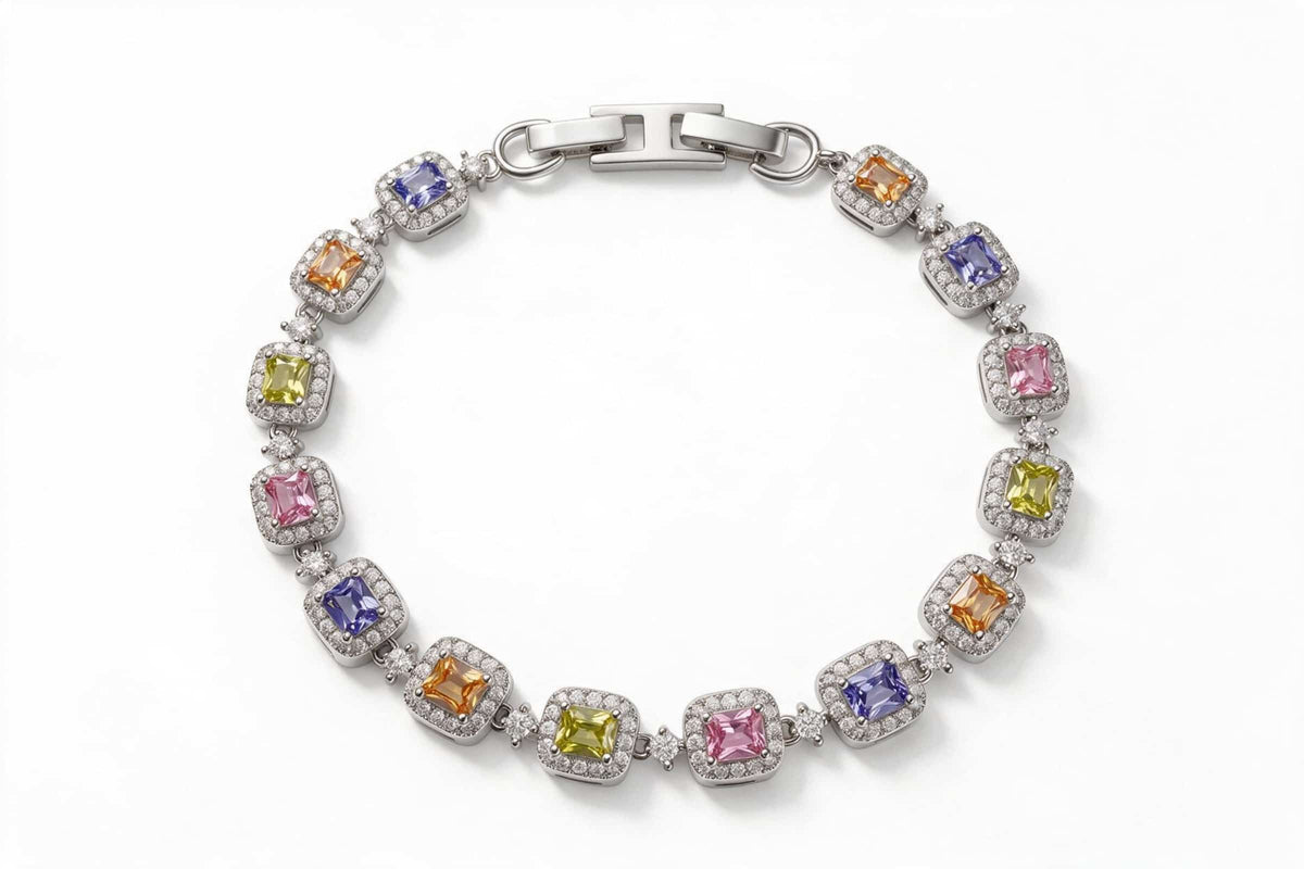  MAROVA JEWELS platinum-plated tennis bracelet with a rainbow array of emerald-cut cubic zirconia stones in purple, orange, yellow and pink, each accented by a dazzling cubic zirconia halo, fastened with a polished H-clasp, colorful luxury fashion jewelry on clean white background