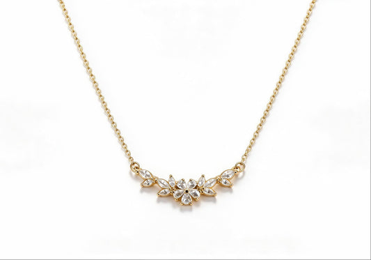 Gold-plated brass statement necklace featuring a cluster of flowers encrusted with zirconia stones