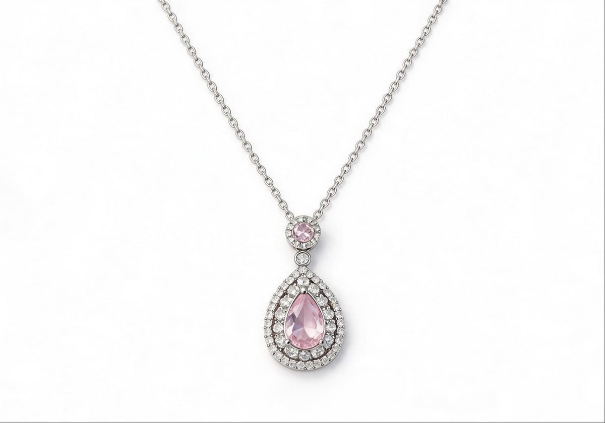 White gold-plated statement necklace featuring an oversized pink zirconia teardrop pendan