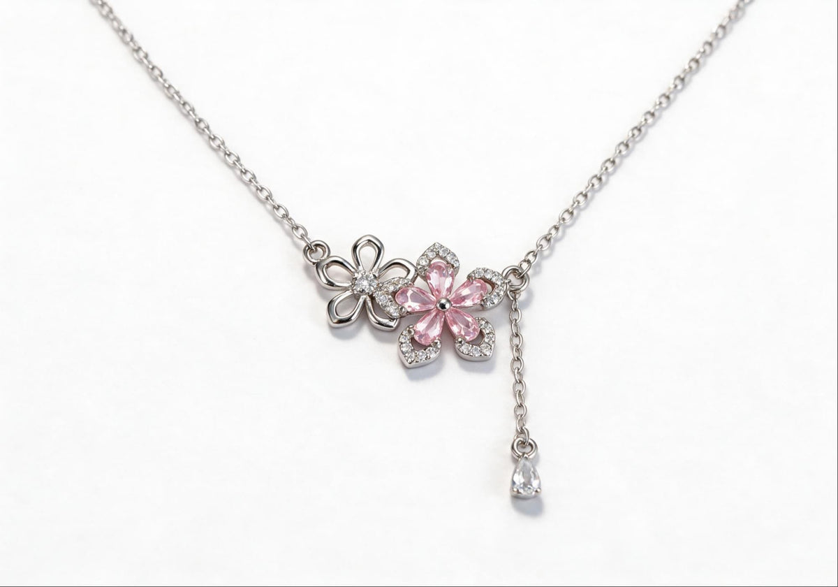 White gold-plated necklace featuring a delicate pink zirconia flower pendant