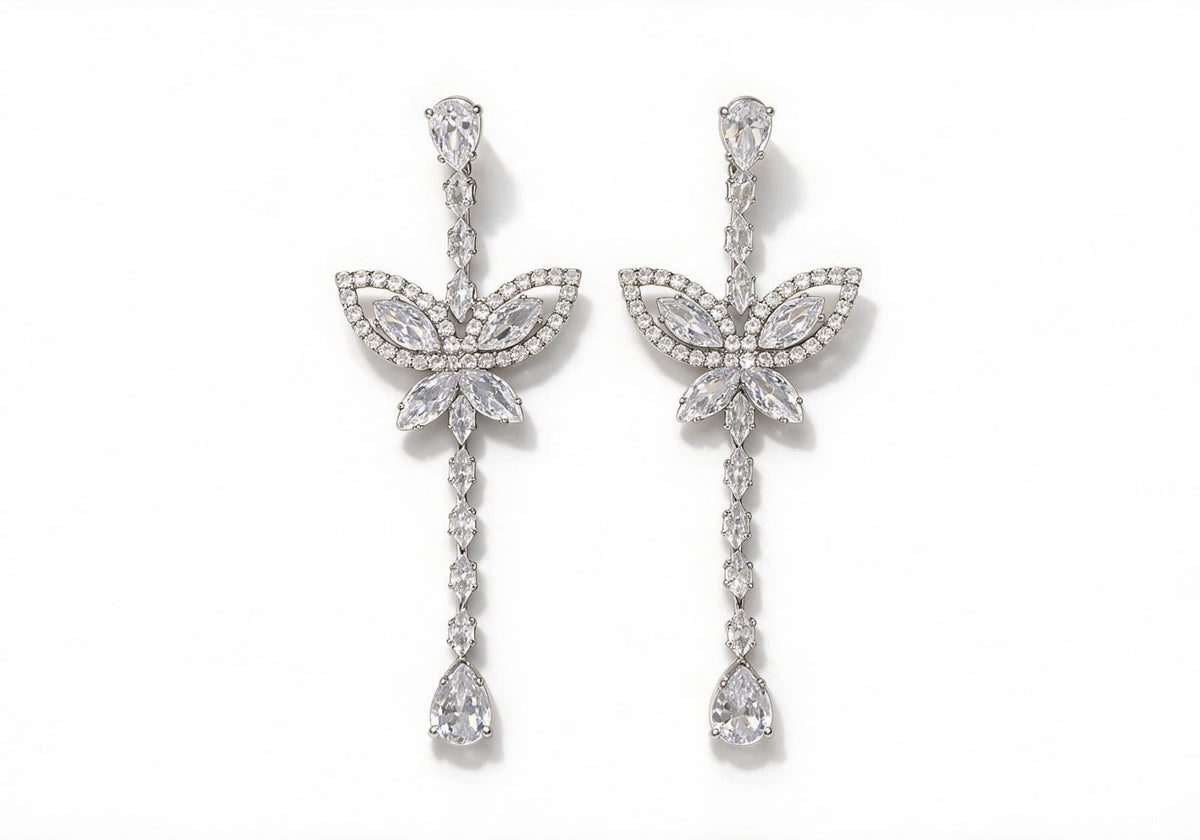 Silver-tone elongated drop earrings featuring a floral leaf center and a mix of marquise, teardrop, and square-cut clear zirconia, finishing with a large teardrop stone.