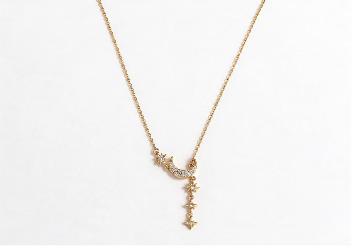 Gold-plated brass necklace featuring a celestial sun and moon design with zirconia stones