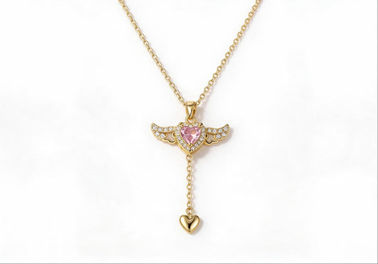 Gold winged heart pendant necklace with zirconia stones